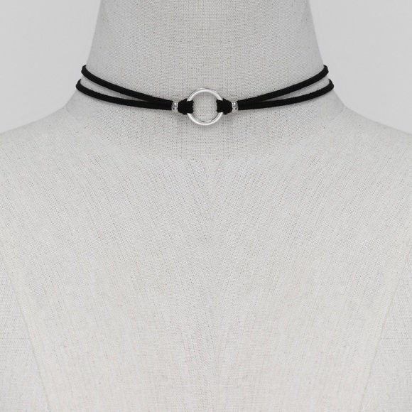 Suede effect choker with silver tone circle design.