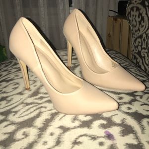 Nude, point toed heels