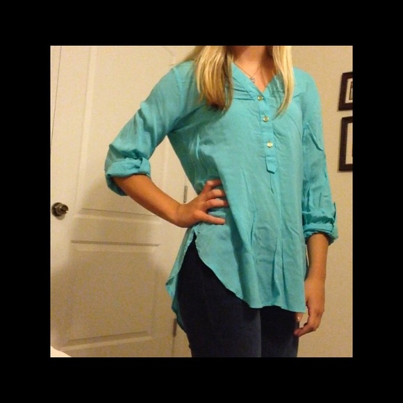 Blue quarter button up blouse.