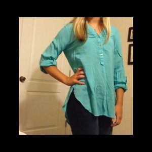 Blue quarter button up blouse.