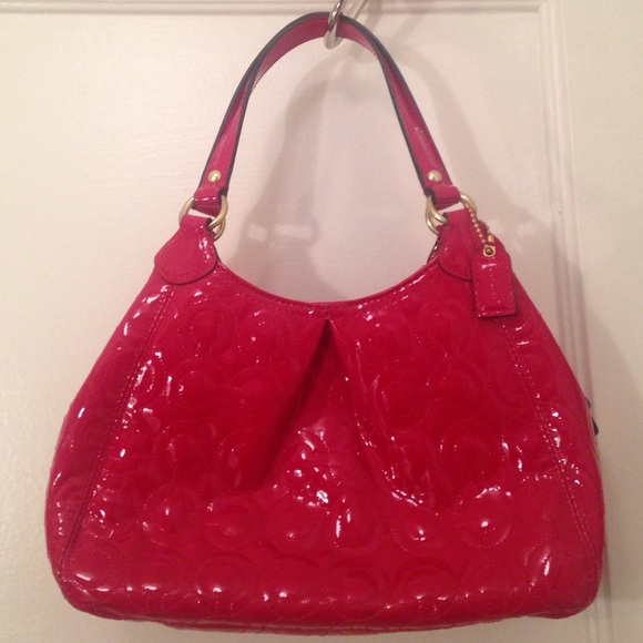 Small, red patent leather Coach handbag