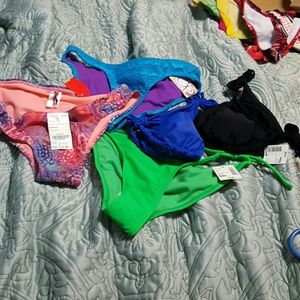 Bathing suits all sized medium all brand new.
