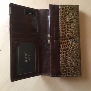 Leather tri fold brown wallet