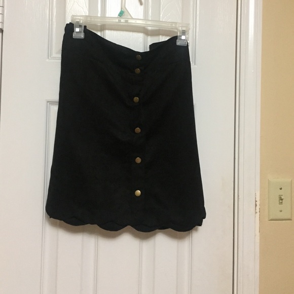 Black suede mini skirt.