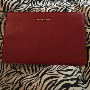 Red Micheal Kors laptop sleeve