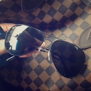 Black on black Ray Bans aviators