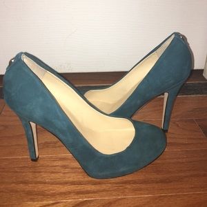 Emerald green suede Ivanka Trump pumps