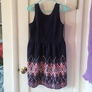 Navy blue sleeveless dress.