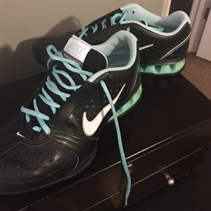 Black and aqua Nike shocks