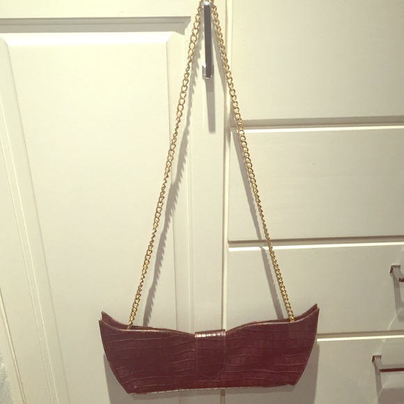 Maroon snake skin clutch with gold chain