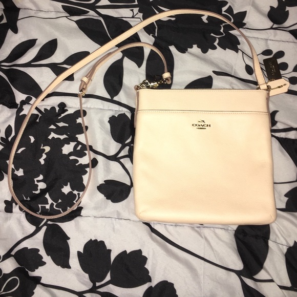Coach Pink North/South Crossbody tag shown