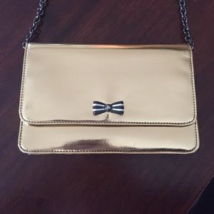 Gold Henri bendel purse with chain