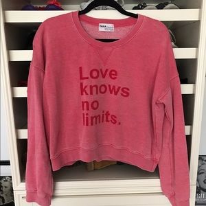 "Love knows no limits." sweater