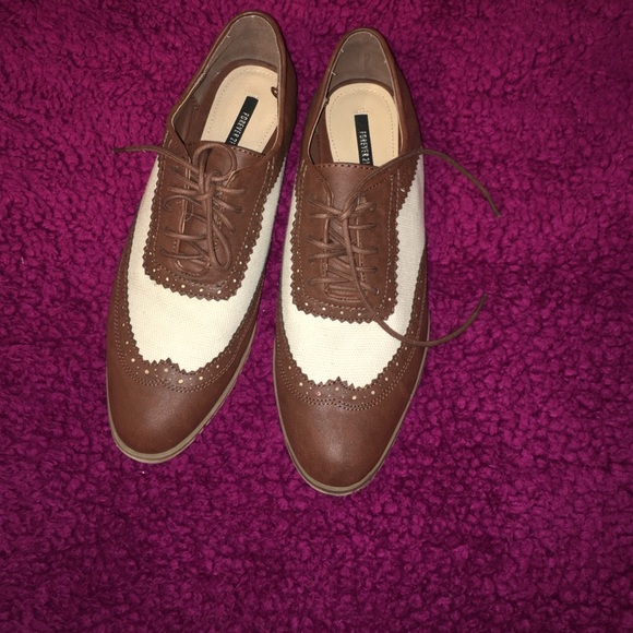 Brown and white oxfords