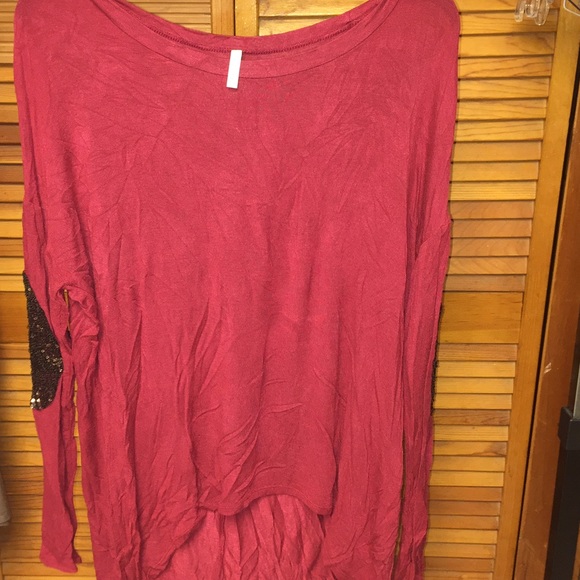Red long sleeve hi-lo top with sparkly elbow