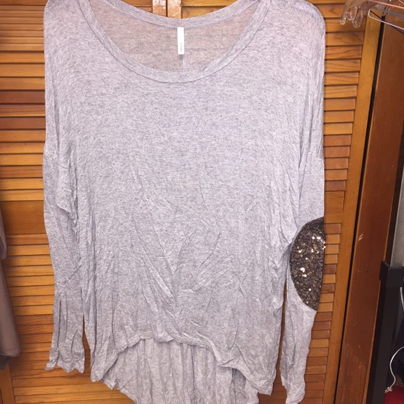 Gray long sleeve hi-lo top with sparkly elbow