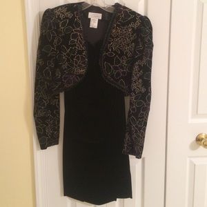 Black velvet strapless sheath.