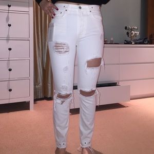 Skinny white jeans with gromets and rips (size 27)