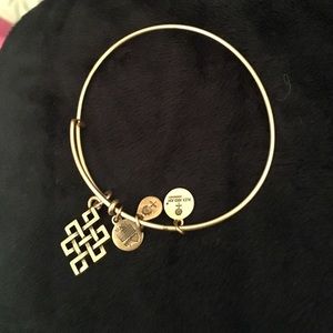 Gold "Endless Knot" Alex & Ani charm bracelet