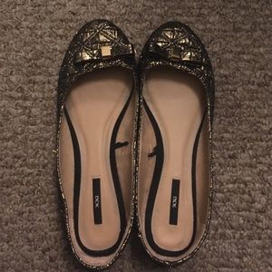 Gold and black flats