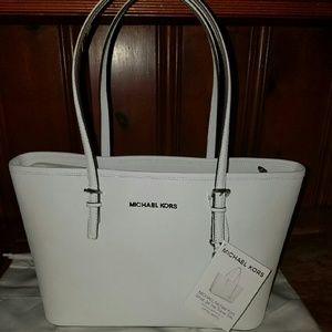 Sold Authentic MK small jet set travel tote