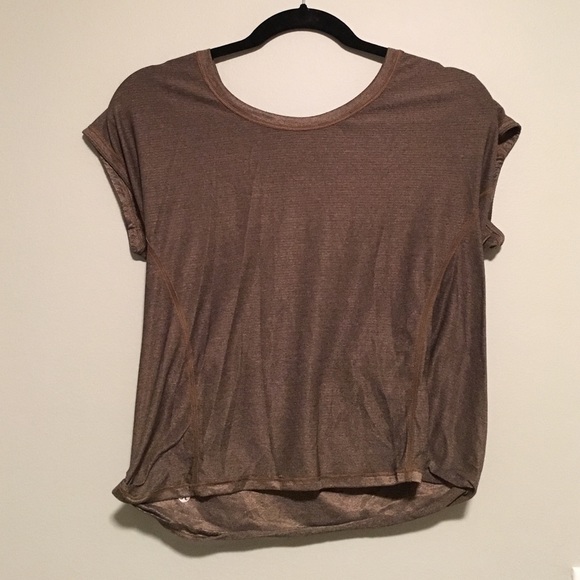 gold, open back shirt
