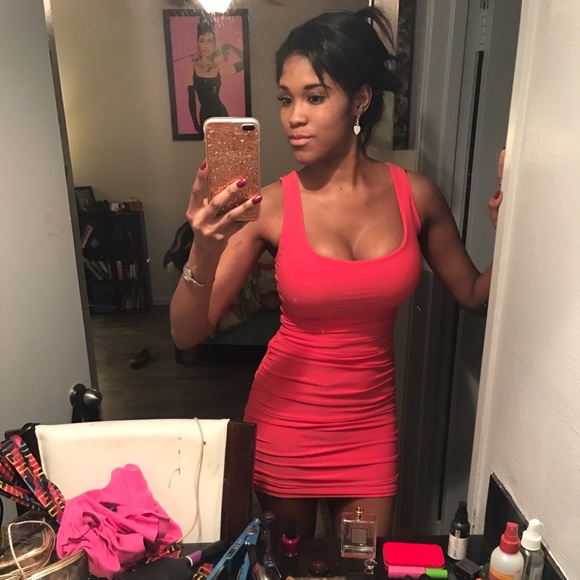 fitted dress Size small and it's a coral color.