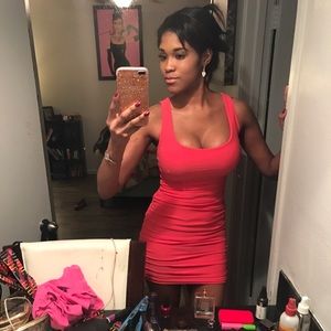 fitted dress Size small and it's a coral color.