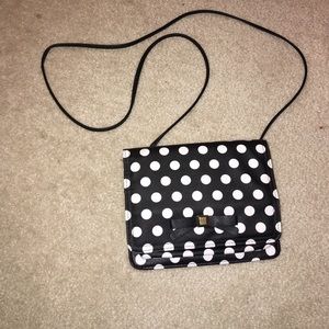 Black and white polka dotted purse with bow