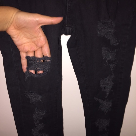 Distressed black skinny jeans