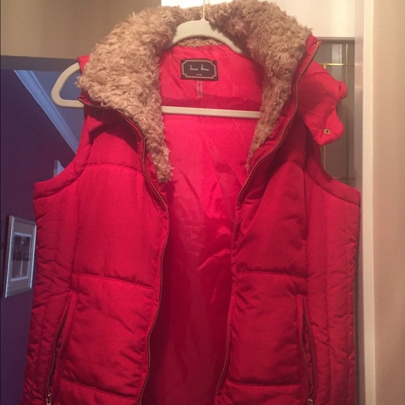 Red puffer vest with faux fur hood