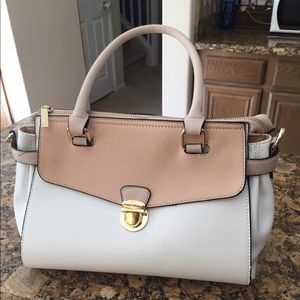 Salmon colored and white purse