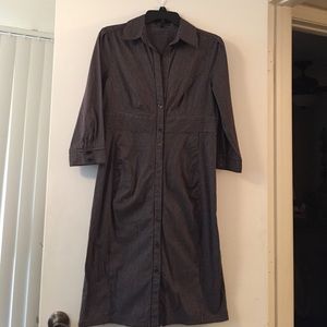 Black button-front striped shirt dress.