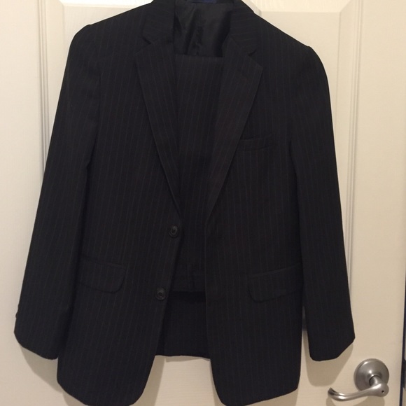 Boys 2 piece suit with shirt and belts.