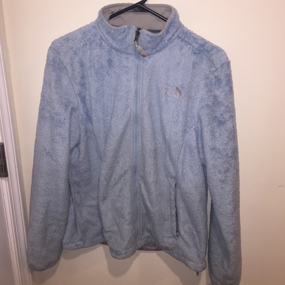 Blue fuzzy north face jacket