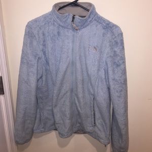 Blue fuzzy north face jacket
