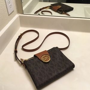 Michael Kors large Fulton logo cross body in Brown