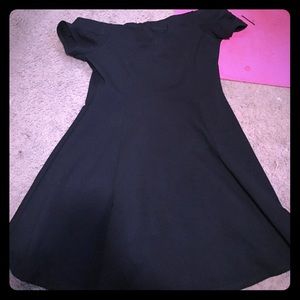 Women's off the shoulder black mini dress.