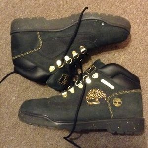 Black Timberland Boots with Gold Accents