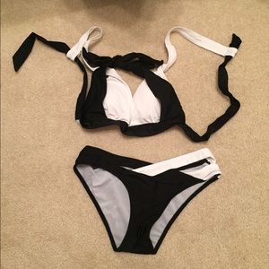 Never worn, cute black and white strappy Swimsuit