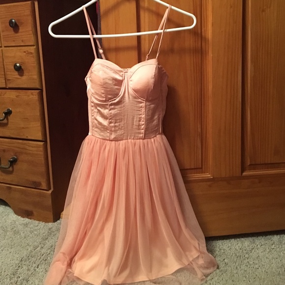 Light pink corset style dress.