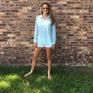 Teal shirt. Size medium. Never been worn.