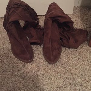Brown high heeled boots with fringe