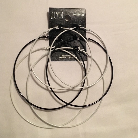 3 pairs of black and white hoop earrings.