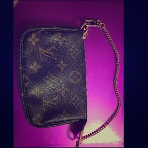 Authentic Louis Vuitton wristlet with gold chain