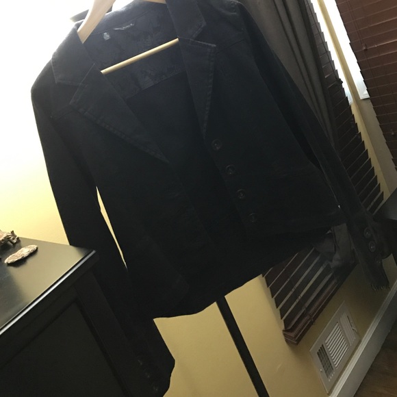 Black denim jacket. Long sleeve length.