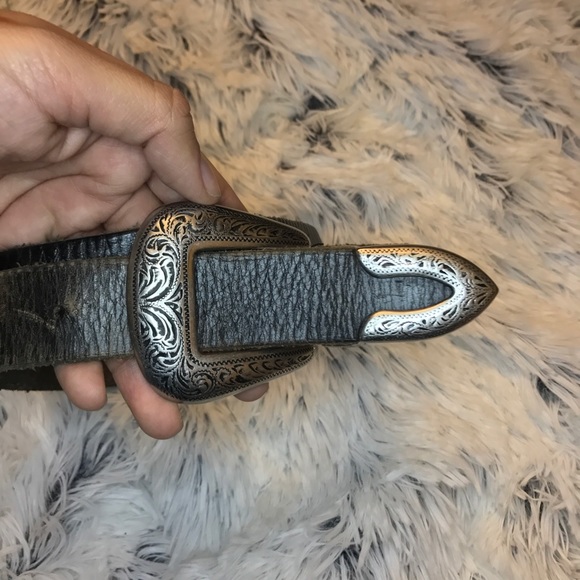 Silver buckled belt