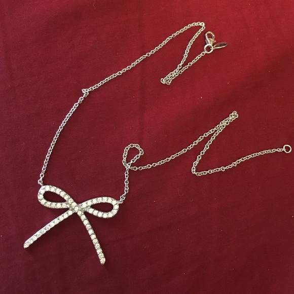 Silver bow and rhinestone necklace