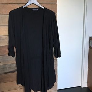 Michael stars draped, open sweater