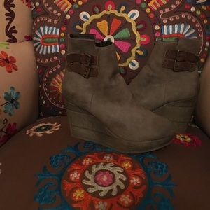 Beige wedge booties with brown buckles